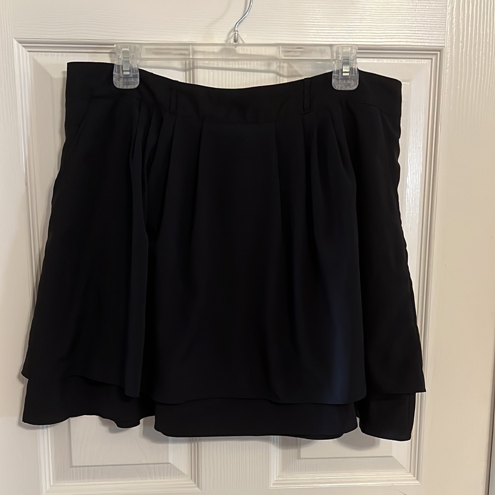 Black layered skirt with pockets.